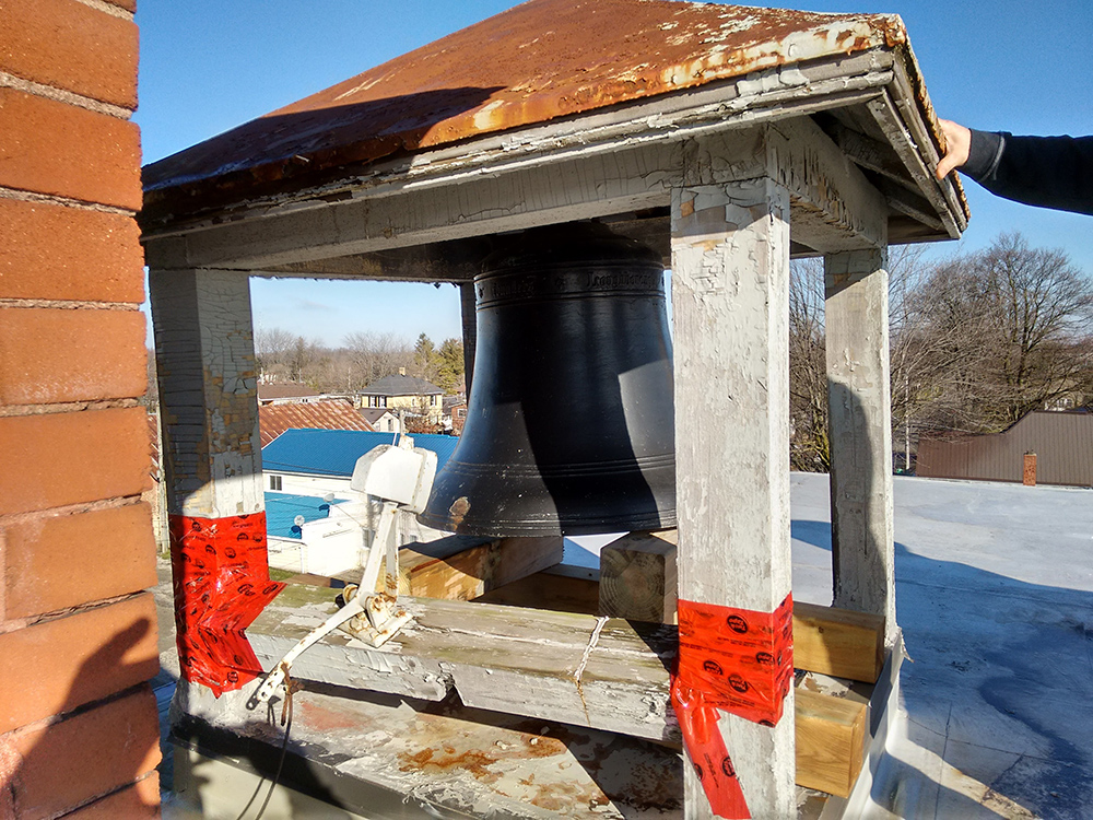 The Old Post Bell secured on roof