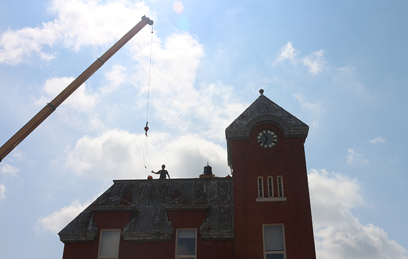 michael hendrick on roof of harriston old post