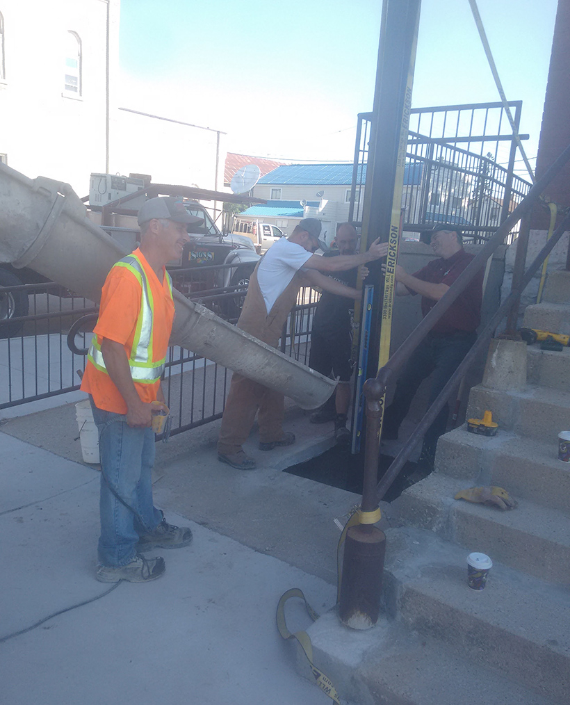 pouring concrete for new sign post