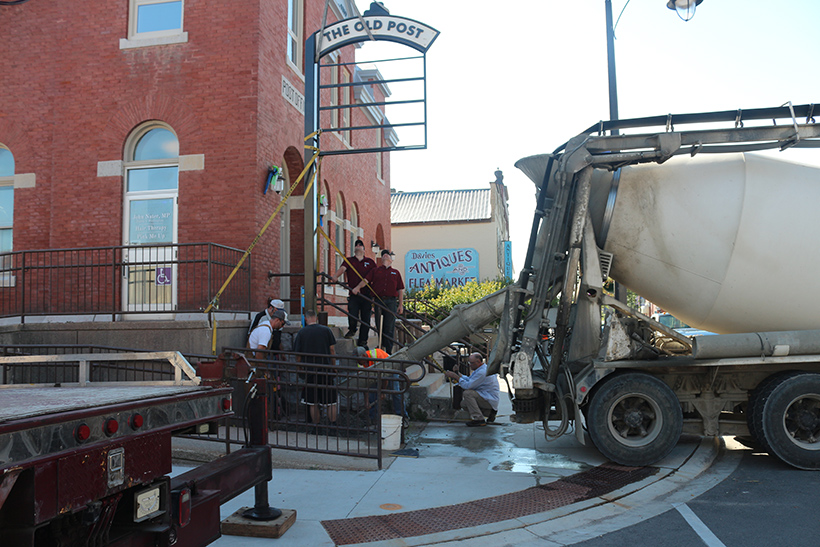 pouring cement for new sign