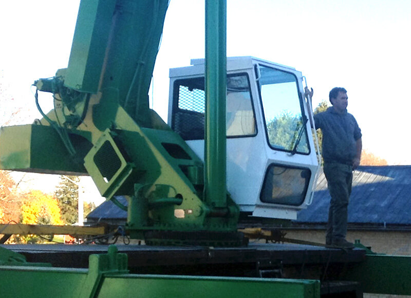 contractor standing on large crane