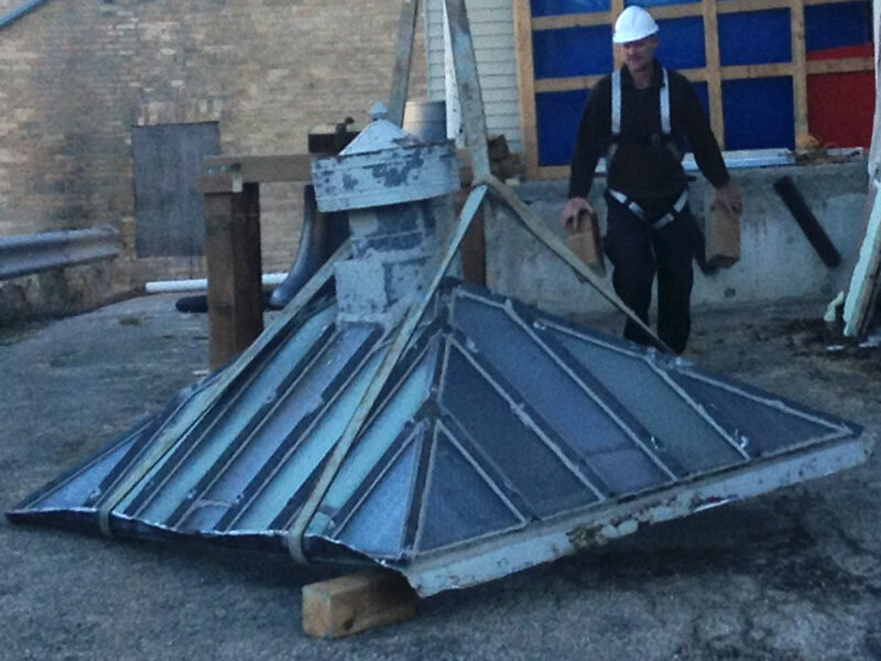 contractor reviews skylight at harriston old post