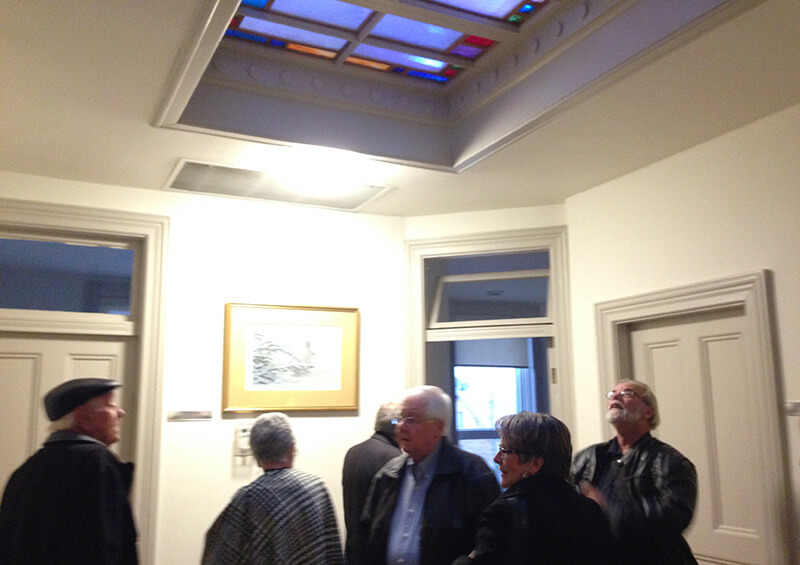 people tour second floor of harriston old post office